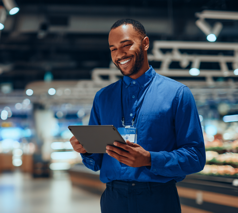 Man smiling with a tablet